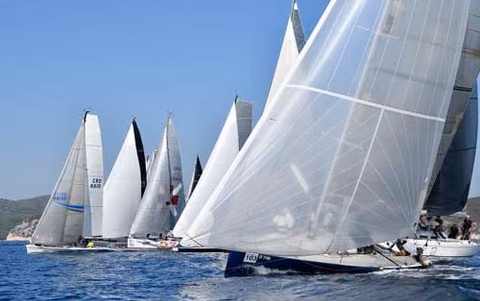 Racing yachts bunched together at the start of the Viška Regata
